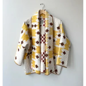 The Parenting 2025 Parker Posey Yellow & White Quilted Coat
